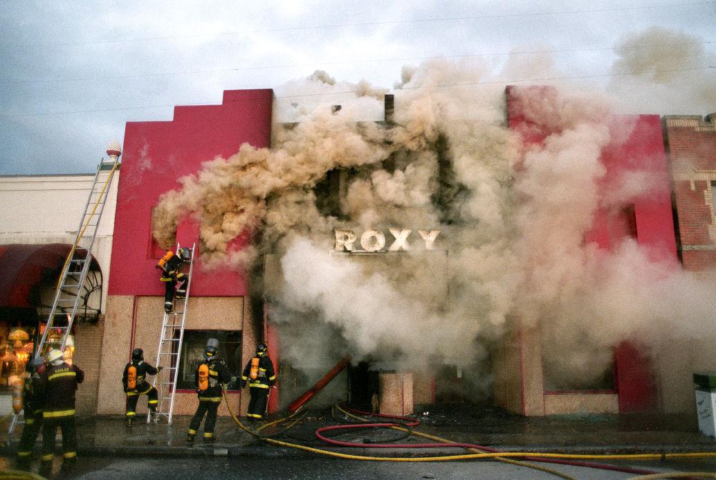 Missoula City firefighters battle in vain to douse an arson fire that gutted the historic Roxy Theat