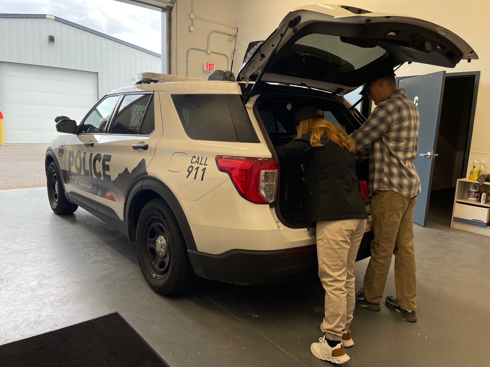 Volunteers Stocking New Patrol Car